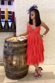 This was a perfectly fun and flirty dress that I wore to the races. I ordered a size small and it fit great (bonus points for hiding any sort of belly pooch) however I had to get the cup sizes altered to fit. They were huge (and I'm a 32D!) I'm not entirely sure how these cup sizes would fit on someone who is more flat chested. Definitely worth getting it tailored especially since the dress was so affordable. - Monica B.