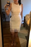 I bought this as an option for either my bridal shower or rehearsal dinner. It was kind of a back-up, but I ended up really liking it in person and may end up wearing it for my rehearsal dinner. I ordered an XS and it is a little snug on my chest, but that was to be expected, and it still looks good. The tassels at the bottom add a little fun to it! - Julie M.
