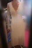 It is a beautiful dress and super good quality, unfortunately the upper part of the dress is way too big for me, which causes the back to look weird, and it's also too long. I usually wear size M, but measured myself and ordered size S to set myself a goal to lose some weight until the wedding. According to the measurements, the dress should've been a little bit too tight. Not sure if I'm going to order it in XS again... - Laura S.
