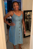 This dress is really cute! I've been going back and forth between a medium and a large since I get a size large sometimes depending on the dress but since it had an elastic back I went with the medium and it fits good! A little tight with the buttons on my upper torso but the large would have been too big. The elastic back is what makes the medium work! - Taylor M.