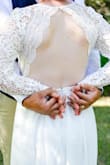 I loved this dress! I bought this dress for our vow renewal and I am so happy I did! I did have to have 3.5 in taken off the bottom but I was expecting this. It was a perfect fit! I did notice the sleeves were a little big and could have been taken in, but I did not feel the need to do that. - Jessica F.