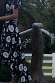 Bought this dress for an outdoor wedding in FL (extremely hot & humid outside). The dress is super light weight & very comfortable. Being so tall I always get worried about ordering online.. but it fit perfect. It would of been a little short with heels but with flats it looked great. I love that you can tighten and loosen the dress for your waist. The V neck on the dress didn't hang to low or more around a lot. - Samantha G.