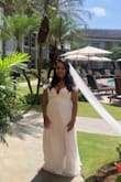 This dress was perfect for our beach wedding in Jamaica. It's very comfortable and light. I was also 5 months pregnant at the time. I ordered an XL and it fit perfectly 2 weeks before the wedding. I did have it tailored to add 1 inch to the side just in case I grew and had the length shortened. I also had that slit taken up higher to add more sexiness. So happy with my purchase! - Jessica Z.