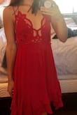 If this dress were a little cheaper I would have kept it. Love the red and the details- This dress is perfect if you're a bit taller with big boobs! My small ones didn't really fit with the dress even when I tightened it up. It's also asymmetrical at the bottom with long sides, going to my knees and making me look shorter. The black one is a bit more universal. - Cameron P.
