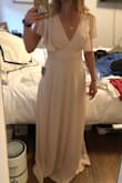 This dress is so pretty and comfortable. The sleeves add a very cute touch but feel great. I ordered it as a bridesmaid dress and can't wait to wear it! - Campbell S.