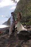I wore this dress when I eloped while in Hawaii. This dress is fabulous. It is simply yet flowy and graceful. It was perfect in every way and exactly what I wanted. Our wedding photographer also loved this dress. It was super photogenic as it flowed so well with the breeze from the ocean and had a super dramatic effect. I did have to have this dress hemmed as it was very long and I was just in flip flops. The bodice fit perfectly, a tad large in the chest but the straps are very adjustable and you can tighten as you need. I also added a stickie bra to help fill the cups out a bit more. It was perfect.
**I want to add that I loved this dress so incredibly much that I bought this dress in black for the rehearsal dinner for my sister's wedding, (part of me is tickled pink about owning my wedding dress in black). When the black dress came it also fit perfectly in the bodice but it was much much shorter then the cream dress was. So much shorter that it did not need any hemming and I need to wear flats with it! The cream dress was so much longer then the black one was! I'm not complaining since I'm glad I don't need to pay to get it hemmed but if I was a taller person the black one would have been too short. I still love this dress and I feel gorgeous in it. - Jaime R.