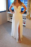 Dress is a beach style. It received so many compliments. I felt very happy and beautiful on a wedding day.
Dress is long so need to hold it while walking.
Before ordering, I have measured myself, also asked advice via live chat. I ended up ordering size M. It was way too big. Then I ordered a size S but it was still a little bit big. Unfortunately, I didn't have time for reordering anymore and already spent money on expedited delivery twice. I think Xs would have been perfect. Overall it is GORGEUS! - Sigita B.