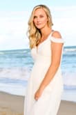 I'm actually about 4.5 months pregnant in these pics, and I love that you can't tell. I ordered a large (didn't know how big my bump was going to get) and had it altered. It was absolutely gorgeous on and it was very comfy. - Jozi D.
