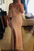 It's a very beautiful dress. It fits like a glove. I only wish it were a few inches longer, but oh well. Will be perfect for a summer wedding. - Katelynn M.