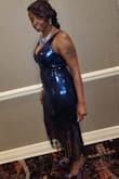 I love the brand. The dress runs true to size. I received tons of compliments. It fit like a glove. I normally wear a 14. The dress has a slight give to it. - Gertha T.