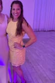 Wore this to a wedding. Beautiful yellow color. Definitely has a snug-fitted fit but was still comfortable. Material was thick enough so it felt fine without a bra. - Andrea R.