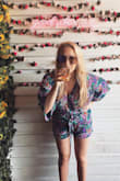 I loved this romper!! I have a short torso and can NEVER find rompers that look good on me but this one was perfect! I have a pretty large bust and I was able to wear a normal non padded bra with the top hooked/buttoned and it was just the right amount of cleavage without being too out there. The sleeves are a little longer than I was expecting, came down past my elbows but I still loved it none the less. Got SO many compliments at brunch. Would definitely recommend this little romper for a fun day time event! - Jessica J.