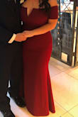 I originally ordered an XL with the hopes it would fit a little looser in the stomach and hip areas, but the top was too large.  I ended up just wearing the L with spanx and a stick-on push-up plunge bra and it was perfect!  I had to have the length shortened only.  The material is thick and is of great quality.  I received SO many compliments on the color and style!  I felt classy, sexy, and elegant...that's hard to find in a dress! - Aubrey S.