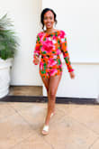 I absolutely loved wearing this bright floral romper on my vacation in Cali! The open back is gorgeous! Although I did not wear a bra and felt fine,I recommend wearing petals with this piece! This romper was a little short on me (I am 5'4) and deff would size up to SMALL next time for length! Otherwise, I thought this piece was so unique and cute!! - Sarah S.