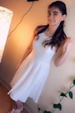 I bought this dress for my niece to wear to her semi-formal. she absolutely loved it. The fabric was thick and surprisingly not see through which many white dresses are. It fit her perfectly and she looked so great in it! - Melissa R.