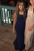 The dress looks exactly how it's shown in the pictures on the website. Great fabric quality! Loved the color! But I did have to get it tailored since it was really long for my height but after getting it fixed, it fit perfectly. Highly recommend this dress! - Angela F.