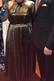I absolutely love this dress! I wore it for my engagement party, it definitely makes you stand out. The dress does run big so you should definitely size down! - Synethea V.