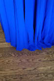 This dress fit perfectly through the midsection, and though I didn't quite fill it out without a bra you can go without (pic is without). You can also easily wear a deep v strapless (or even a regular deep v bra with the straps just tucked in). The only issue I had was the hem was very uneven. I would have had to address that had I not gone with a different dress. Also of note: this dress is HEAVY. The multiple layers of fabric make it flow beautifully, but it definitely weighs on you. - Erin W.