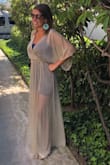 Amazing color. Beautiful dress. Doesn't make me look as thin as I could because of the dress design but I've liked wearing it. I'm 5,5 and believe I ordered a small but had to hem the bottom a few inches. :) - Stefanie P.