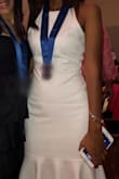 I purchased this dress to attend a formal graduation and was in love with it! It fits like a glove and I got so many compliments on it. Love how it sits on your body perfectly. - Daphne D.
