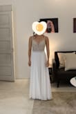 I saw this dress after I'd already purchased a wedding dress from a traditional bridal shop, but with the price, fast shipping, and Lulus return policy I couldn't resist getting this as well. And I'm really glad I did! (I just wish I'd found this dress before getting my first dress as it would've saved me a lot of money. Moreover, it's been 4 months and I'm still waiting for that dress to be delivered.)

This is a gorgeous wedding dress. I love the beaded bodice and the low back. The skirt drapes beautifully, and it's super comfortable to move around in (a must for me). Overall a very flattering dress. It comes with bra cups seen in but I will still wear a nubra to add oomph.

I'm short (5') so I had to get the hem and straps shortened. There's a slight train but I decided to get it hemmed to the same length all around since I didn't want any part of the dress dragging on the ground. The dress fits a little big (smallest size available is a 2), but there is an additional set of hooks at the back that helps cinch the dress slightly tighter around the torso, so that helped me avoid any additional alterations. - Stephenie L.