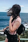 Super cute mini-backpack/statement piece to have for on the go! It's small enough to have as a lil daypack without worrying about it being too heavy and big enough to fit my camera + 50mm lens. The straps do come separately and are a bit difficult to adjust but not impossible. - Rosemary R.