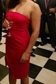 Fits perfect. Definitely ok for larger busts. It's bodycon-ish but I would still recommend wearing spanx to suck everything in. The cherry red is absolutely gorgeous. - Diana R.