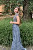 This isn't an adjustable wrap around skirt, but it fits perfectly anyway! I wore this on a trip to Italy since many of the churches require your knees to be covered; even though I was walking around in the hot sun all day, the skirt was very breathable and the material + the length was perfect for the weather and long walks. - Libby E.