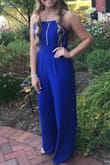 Loved the way this jumpsuit fit! It was a little long but with 3 inch heels added to my height I didn't have to alter the bottom or anything. I added a large necklace to dress it up a bit for a wedding. Very light material and good for summer wedding outside. Loved the vibrant color! - Rachel H.