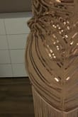 My normal size is large, but I ordered medium and it fit good too. I do not like the color (rose gold) it's too bright, I might return it for the blue one. The bottom decorations are cute. The zipper creases up in the back, maybe I need the large size...not sure - Silvana F.