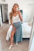 This skirt is adorable on and has the high slit which is very flattering! Great quality and love the idea that it's not a true wrap skirt it has a zipper. - Taylor B.