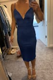 Dress is soft, stretchy, and flattering. Was too big for me in the chest area (not uncommon for my body type). Would have kept it if not for this. Color is a pretty royal blue. I am 5'5 and the dress came down to a little below the knees. - Mariah S.
