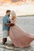 I ordered a few different dresses for our family pictures and I'm so glad I chose this one! It photographed beautifully and was exactly what I envisioned!!! It was comfortable and I loved how it flowed. It is cut a little low but I added a bralett under it and it looked stunning. I am getting tons of compliments on our pictures:) - Kelly E.
