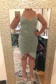 A lovely dress, not as "bright" in person, more on the dusty mint side.
A bit too sexy for my family wedding event that I hoped to wear it at, but if it was a friend's wedding I might. the front slit is directly in the middle, not slightly to the side like I thought/wanted.
If I didn't have anything else as an option, would keep. - Danielle C.