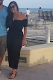 I absolutely love this top. It fit perfectly and it covers up my arms which are my problem area. Its also very versatile. Here it almost looks like a romper,  paired with high wasted pants. Great breathable material too. It was really comfortable in the middle of summer in key west! - Emily H.