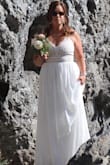 I was so pleased with the quality of this dress and received many compliments on it for our informal outdoor wedding. 

The zipper was a bit sticky, but I fixed that by running a wax candle over it a few times. - Patricia M.
