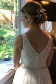 I actually ordered several dresses from Lulus to try on for my small wedding this August. I loved them all and had a tough time choosing, but ultimately this dress won my heart! It was absolutely beautiful and exactly what I was looking for. I ordered a medium and did need to alter the length and bring in the waist and straps a little bit. I couldn't have asked for a more perfect dress to get married in! - Samantha M.