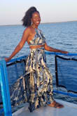 Love this dress! The material is light so it's perfect in hot climates. It flows nicely when you walk too. It is alittle long if you wear flats so you may have to tie it at the bottom or hold the sides when walking up/down stairs. - Phoebe S.