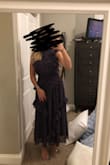 This dress is gorgeous. I purchased it for my boyfriend's brother's rehearsal dinner and I think it's going to work perfectly. It's a little long, but things usually are on me because of my height. It also seemed a bit loose but I think it was just supposed to fit that way and don't know if going down a size would be flattering. The material is high quality. Given all of the ruffles and multiple layers, it feels kind of heavy but will still fit with the anticipated climate. The material was thick and layered enough that I am not planning on wearing a bra. - Zoe B.