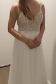 It's a very pretty dress, the beadings are very well done and looks really nice.
Will need to have the shoulder strap shortened and skirt length shortened but otherwise wit is perfect! - Wan J.