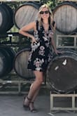 I love this dress. It wraps around so you are able to adjust how tight you want it. I usually wear a small but I went down a size since you can tie it yourself and make it as tight/loose as you need. Also, the top was a little too loose on the small, but when I sized down, the top fit much better. Such a cute dress and the wrap around with little tassels on the string is a cute addition. It is good for many occasions and I received many compliments. Definitely recommend! - Kathryn F.