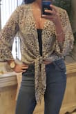 Great fit and very classy and stylish. can be dressy or casual. It's long sleeve with bottons at end of sleeves. - Staci