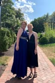 I wore this dress to an August Wedding and it was perfect. I have like no boobs so the deep v-neck was flirty without being trashy. The dress is fitted at the top and the skirt went until just below my knee/mid-calf which was super easy for lots of moving and dancing! The top was kind of loose because of my lack of boobs so if you're nervous I would recommend taping it but it wasn't an issue for me! I loved this dress! - Libby S.