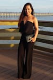 This jumpsuit was true to size, I bought the small and fits perfect, it is so attractive and classy. Overall super satisfied with my purchase and thinking about getting it in RED. 
be prepared to wear more than 3 inches heels, I am 5'1" and had it trimmed. - Iylin F.