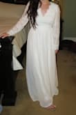 Beautiful dress. Wore for my wedding. Had to alter the sleeves and length, also needed hemming at the waist. Good quality material! - Ashlee M.