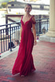Wore this beauty to a formal wedding in Boston this summer - gorgeous, well made, and comfortable. Bust/upper torso area is form fitting but not tight, bottom half is flowy and romantic (plus the slit is sexy but not over the top). - Amanda K.