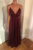 I bought this dress in a small because I have long legs and with a 2 inch heel the dress fits perfectly. It just dusts the floor so I don't even need it hemmed. I debated on getting an XS but I didn't wait to waist to feel too tight while partying at a wedding. I love the open leg slit, it makes the dress feel breathable and moveable. The color is exactly what is pictured and seemed to be perfect for a fall wedding. I also love the adjustable straps as it makes it easier to lift the 'girls'. I am not wearing a bra in the pics and the support is perfect for me. - Leora B.