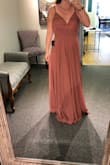 The material is light and flattering. I had to get the dress shortened and a tiny bit taken in on the waste. Perfect for a bridesmaid dress. The color is EVERYTHING! - Gennifer D.
