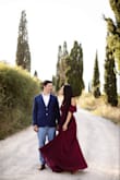 This dress was SO perfect for the location in Tuscany we chose for the engagement shoot. It was such a pretty burgundy and complimented the golden tones beautifully. Such a gorgeous color and great quality! I'm almost always a medium but after reading the reviews about it running a little large and since there was only a small left, I went with the small and it fit pretty well. The waist was a little tight, but as it is a wrap dress I think it worked. If it was available in the medium, I think I would have been more comfortable. Definitely get your size if you have a large chest though. Also, it flows really nicely when the wind is blowing! - Jaclyn H.