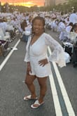 I wore this romper to Diner En Blanc in DC and received so many compliments!! I ordered a large based off of other reviews, but I think a medium would have been the better choice. I loved how comfortable it is to wear and the sleeves draped nicely. The back is the best part and I wore a regular bra with it. Highly recommend! - Cyneatria M.